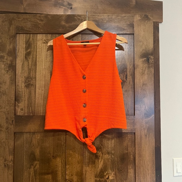 J. Crew Tops - Woman’s sleeveless Blouse. Jcrew. Orange size large. Buttons and tie at bottom.